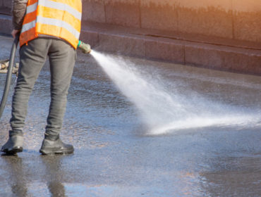 cleaning an asphalt driveway